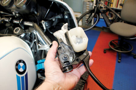 A hand holding handlebars